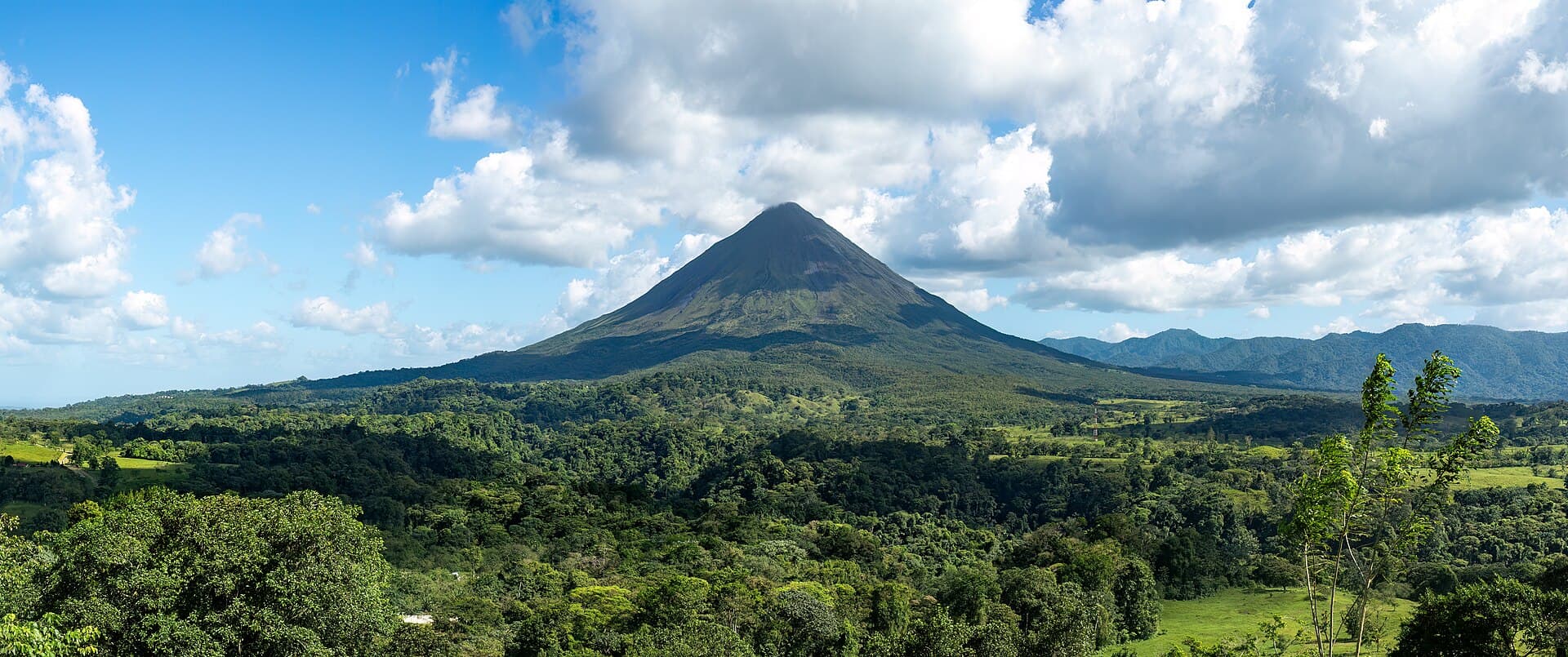 Arenal volcano rising over the Costa Rican rainforest